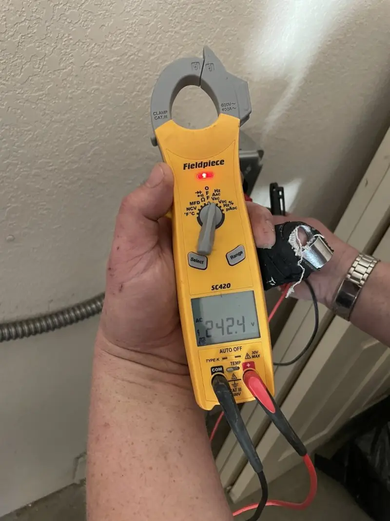 Voltage testing with clamp meter during Electrical Installation Services in Aberdeen